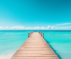 Obraz premium A wooden pier is in front of a beautiful blue ocean