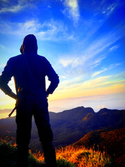 silhouette of a man in the mountains