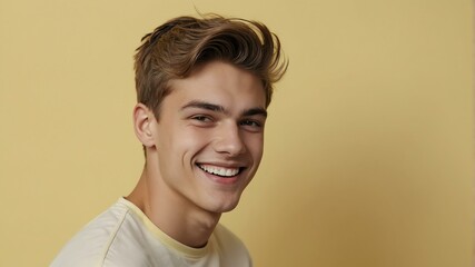Fototapeta premium teenage european man on pastel yellow background model close-up smiling with beautiful teeth for ad concept space for text