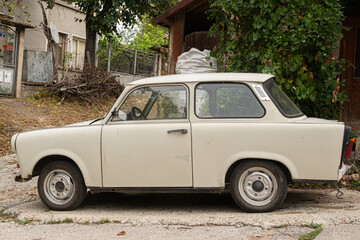 Vintage Trabant car in Eastern Europe village closeup
