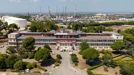 Aerial view of Testa Hospital in Taranto, Puglia, Italy. In background is Taranto Steelworks, also...
