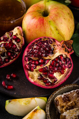Rosh Hashana concept with honey, apple and pomegranate