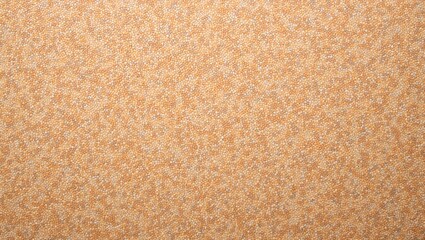 Fototapeta premium Textured cork board with speckled pattern in light brown and tan