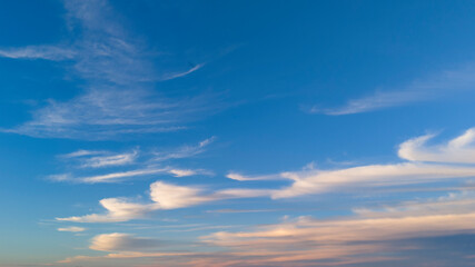 A serene sky showcasing soft clouds and a vibrant blue backdrop. Perfect for nature lovers and anyone seeking tranquility.