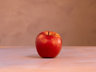 red apple one photo on the front, source of vitamins, warm background