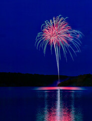 Fireworks Over Water with Reflections on Water Surface