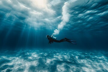 diver scuba diving under the ocean 