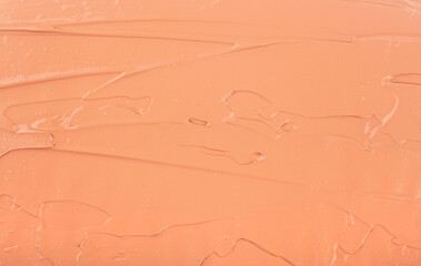 Fototapeta premium Liquid foundation makeup cream texture background. Texture of smudge cosmetic colored cream. Face foundation.