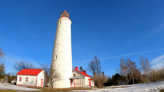 Lighthouse in Point Clark National Historic Site in Goderich, Ontario, under winter blue sky.  It was built between 1855 and 1859.