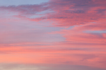 Pink and blue sky with clouds creating a beautiful sunset background