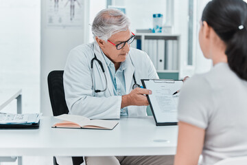 Mature doctor, paperwork and patient in consultation for healthcare, checkup question and medical...