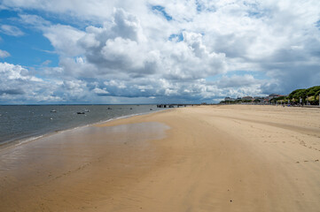 Walking on beach promenade in Arcachon, vacation destination town on Atlantic coast with beatiful parks, villas, streets and sandy beach, France