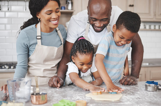 Cookies, baking and black family in kitchen for bonding, learning and skill development in home. Dough, ingredients and African parents teaching children to cook for growth and fun at house.