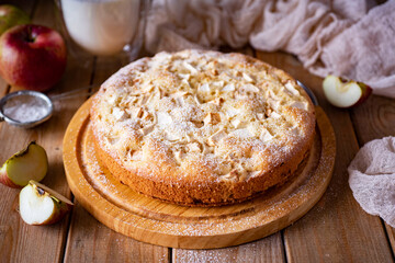 Delicious sweet apple pie for dessert on a wooden table. Apple pie for breakfast on a wooden background. Close-up