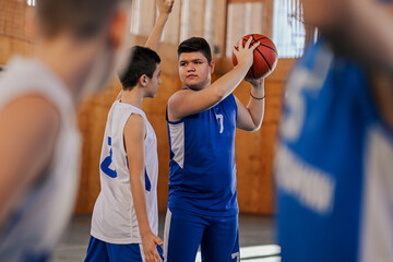 Concentrated player making a pass in basketball