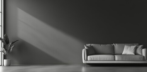 Modern minimalist living room with a gray sofa and plant in soft natural light