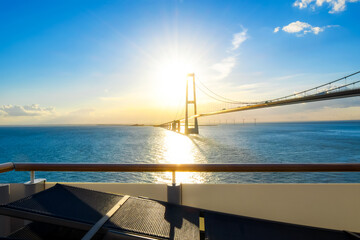 View of the setting sun over the Öresund Bridge which spans the strait between Sweden and Denmark...