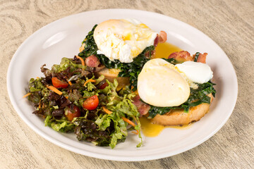 Poached Eggs on Toast with Crispy Bacon and Salad