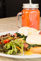 Gourmet Benedict Eggs with Bacon and Greens