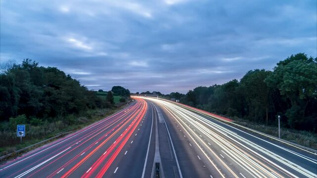 Traffic flowing on uk motorway at night