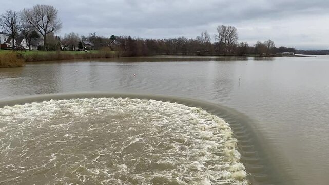 Flooding due to heavy rainfall, full basin at the Lippesee in Paderborn - Sande