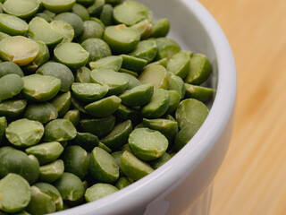 Macro of split peas in a white bowl 