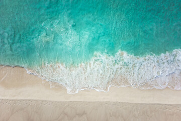 Beautiful sandy beach and soft blue ocean wave in Maldives