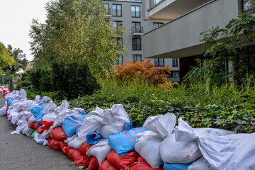 Bags of walking next to the house. Flood protection. Threat of flooding by the river. Wroclaw, Poland September 2024. securing river embankments with bags of sand in Wrocław
