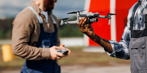 Concept banner technologies in agriculture and livestock. Team operators use UAV drone for inspect buildings of farm
