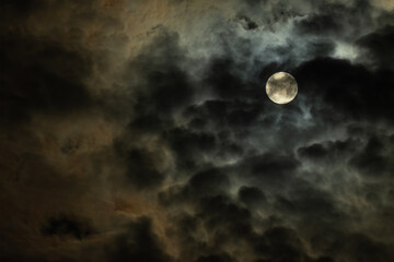 full on dark dramatic night cloudy sky with dense overcast. moody artistic photo for fantasy background or backdrop with copy space