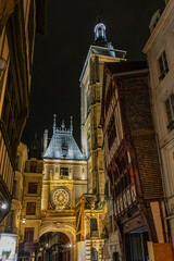 Night view of Great Clock ("Gros-horloge", 1389) a renaissance astronomical clock in Renaissance arch crossing the Rue du Gros-Horloge. Rouen, France.