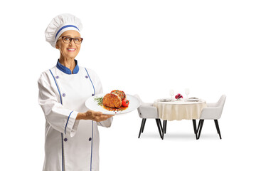Female chef holding a meat dish on a plate, fine dine restaurant concept