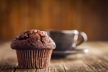 Sweet chocolate muffin cakes. Cupcakes on wooden table.