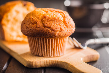 Sweet muffin cakes. Cupcakes on wooden table.