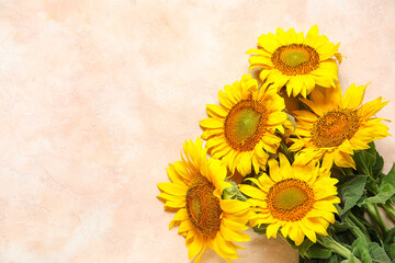 Beautiful sunflowers on grunge pink background