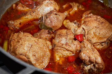 A pot of Brown Stew Chicken, a classic  Jamaican dish