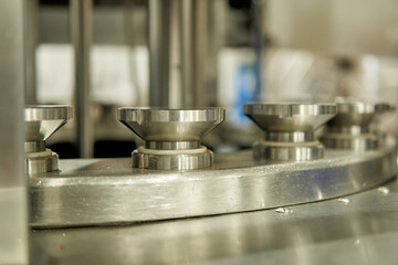 Empty beer bottling machine in the packaging plant of a small craft beer factory