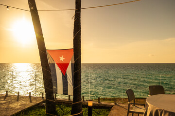 Serene sunset overlooking the ocean in Varadero with Cuban flag