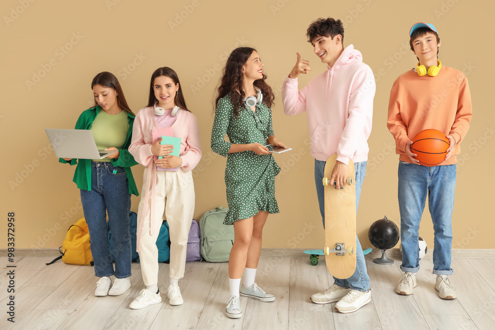 Poster Group of teenage students near beige wall