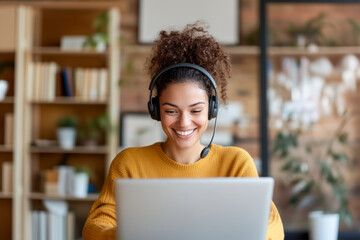 Smiling Woman Wearing Headset While Working on Laptop