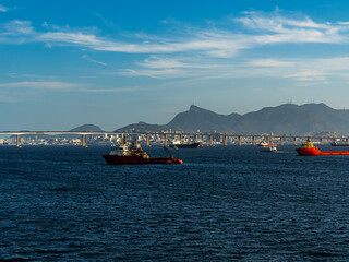 Panoramic view of sea cities. Rio de Janeiro city, bridge, and ships at Guanabara Bay, Brazil.