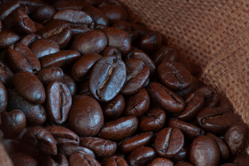 Freshly baked  dried coffee beans on background