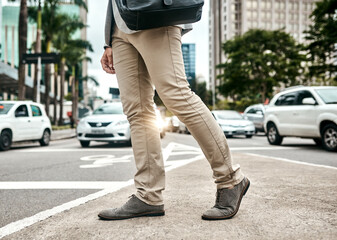 Businessman, legs and walking in city, road and commute in urban traffic to office building. Male person, shoes and professional on journey to workplace, outdoor and employee travel on town trip