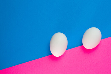 Abstract Image of Fresh White Eggs on Blue and Pink Background