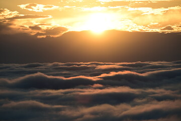 Fototapeta premium sunset over the clouds