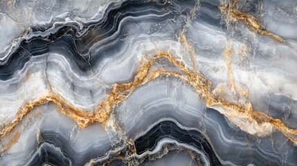 Fototapeta premium Close-up of a luxurious marble surface with a unique pattern of swirling gray, white, and gold veins.