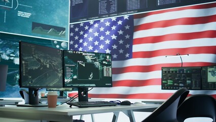 Empty operation room with an American flag running on big screen in control tower, protecting...