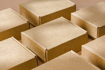 Brown cardboard boxes arranged neatly on a workspace, showcasing packaging materials for shipping and storage activities
