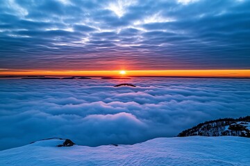 Grey sky at dawn, with the first hints of pink and orange breaking through the clouds