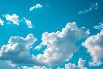 Blue sky with puffy white clouds, beautiful natural background
